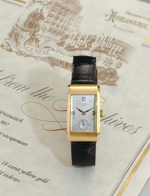 PATEK PHILIPPE. A RARE 18K GOLD RECTANGULAR WRISTWATCH WITH SCROLL-TYPE LUGS