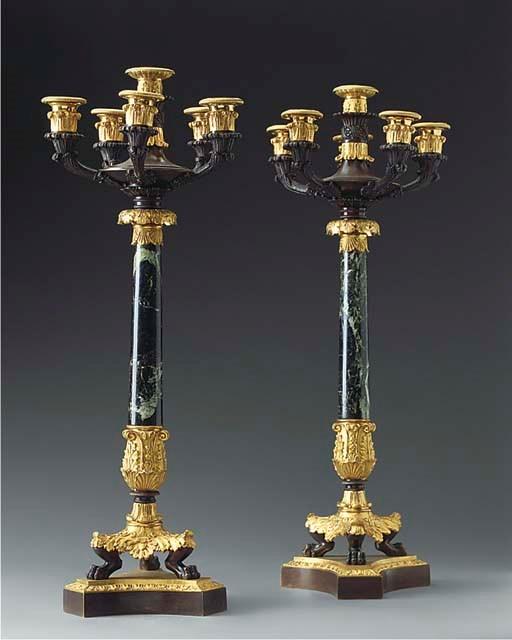 A pair of Restauration bronze and marble six-light candelabra