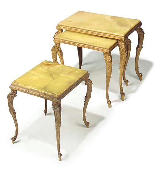 A nest of three gilt metal and onyx tables