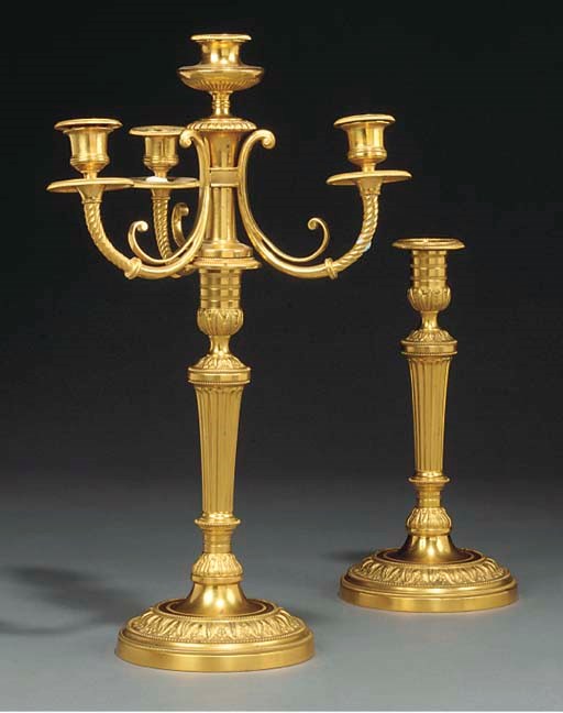 A pair of Louis XVI gilt bronze four light candelabra