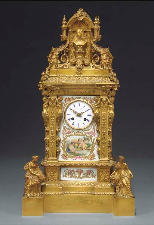 A FRENCH GILT BRONZE AND PORCELAIN MANTEL CLOCK