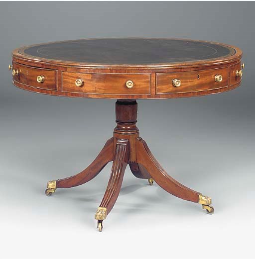 A MAHOGANY DRUM TABLE
