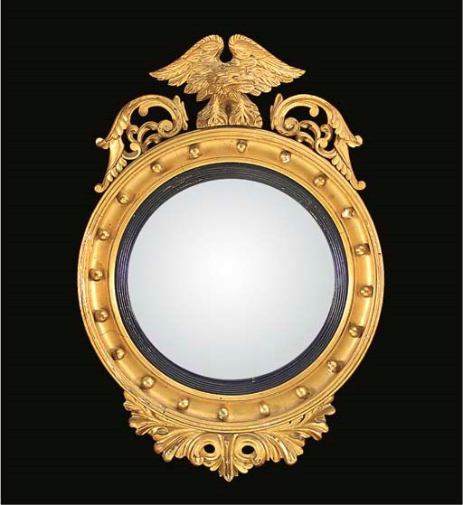 A GILTWOOD AND GESSO CONVEX MIRROR