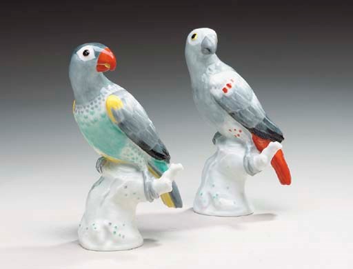 A PAIR OF BERLIN (K.P.M.) PORCELAIN MODELS OF PARROTS,