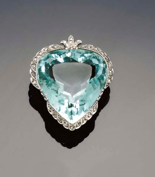 An early 20th century aquamarine and diamond brooch/pendant