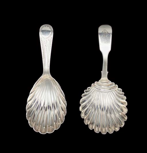 A GEORGE III SILVER CADDY SPOON AND A GEORGE IV EXAMPLE