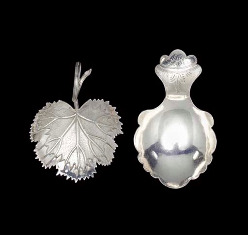 A GEORGE IV SILVER CADDY SPOON AND A WILLIAM IV EXAMPLE