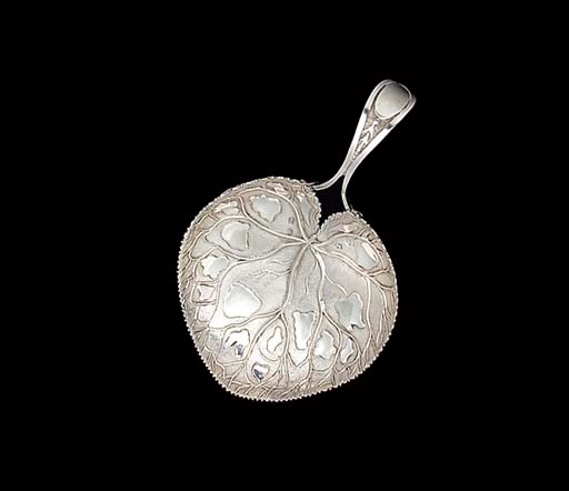A GEORGE III SILVER CADDY SPOON