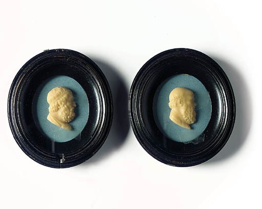 A PAIR OF CREAM WAX PORTRAIT RELIEFS OF PLATO AND SOCRATES