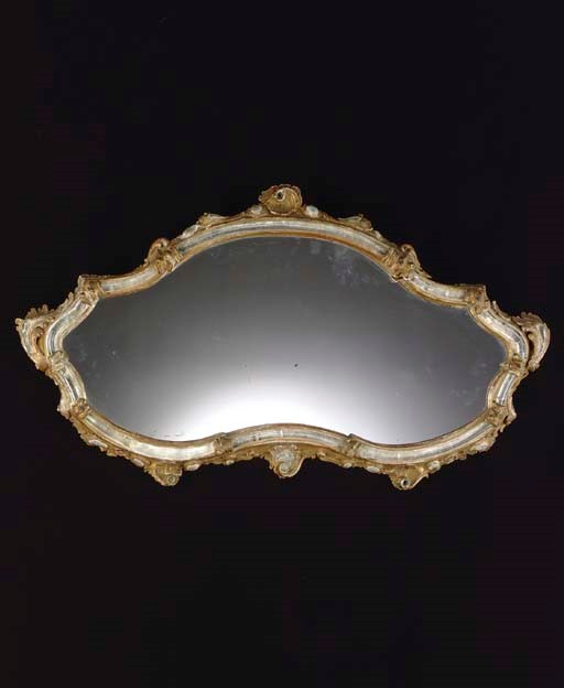AN ITALIAN GILTWOOD AND CLEAR GLASS MIRROR