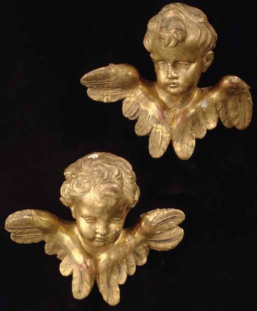 A PAIR OF CONTINENTAL GILTWOOD CHERUBS