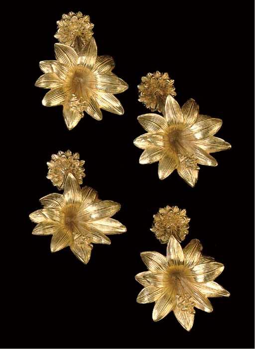 A SET OF FOUR ORMOLU CURTAIN TIES