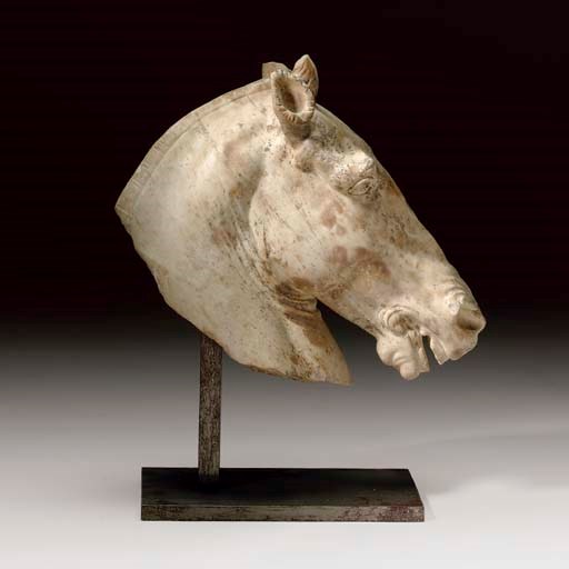 A WHITE MARBLE HEAD OF A HORSE