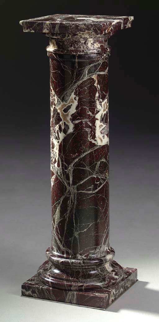 A VARIEGATED RED AND GREY MARBLE PEDESTAL