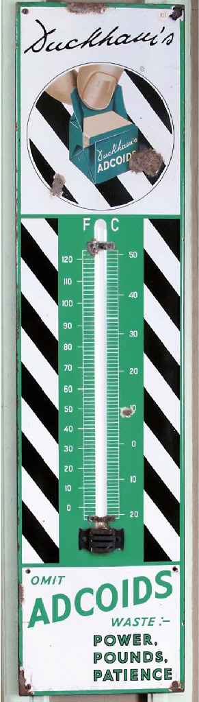 Duckhams "Adcoids" - A pre-war enamel advertising thermometer sign; decorative design and logo; lacking glass-tube; c.1930s. 12x36ins.