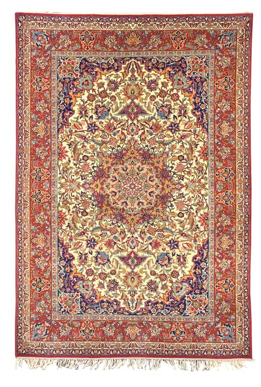 AN ISFAHAN RUG,