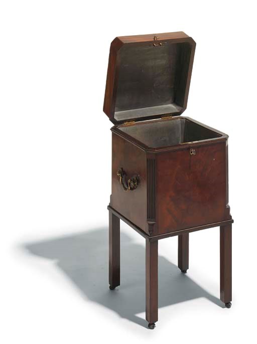 A George III mahogany and inlaid decanter box or cellarette
