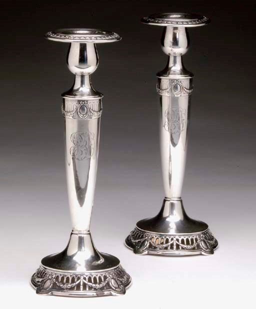 A SET OF FOUR AMERICAN SILVER CANDLESTICKS,