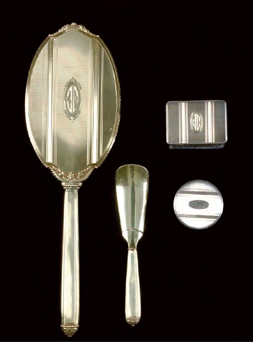 AN ASSEMBLED SILVER AND GOLD NECESSAIRE DE VOYAGE**,