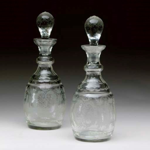 A PAIR OF CONTINENTAL ETCHED GLASS DECANTERS,