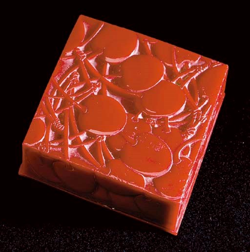 A LALIQUE RED CELLULOID BOX AND COVER,