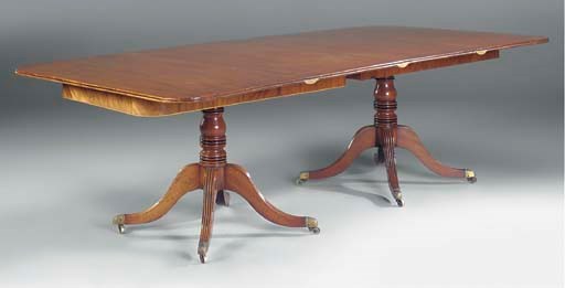 A REGENCY MAHOGANY TWIN-PEDESTAL DINING TABLE