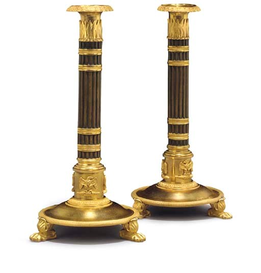 A PAIR OF NORTH EUROPEAN ORMOLU AND PATINATED BRONZE CANDLESTICKS