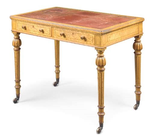 AN EARLY VICTORIAN BIRD'S-EYE MAPLE WRITING-TABLE