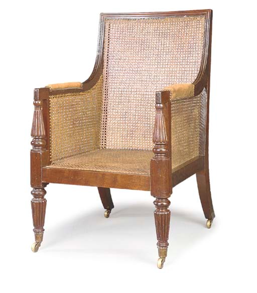 A REGENCY MAHOGANY CANED BERGERE