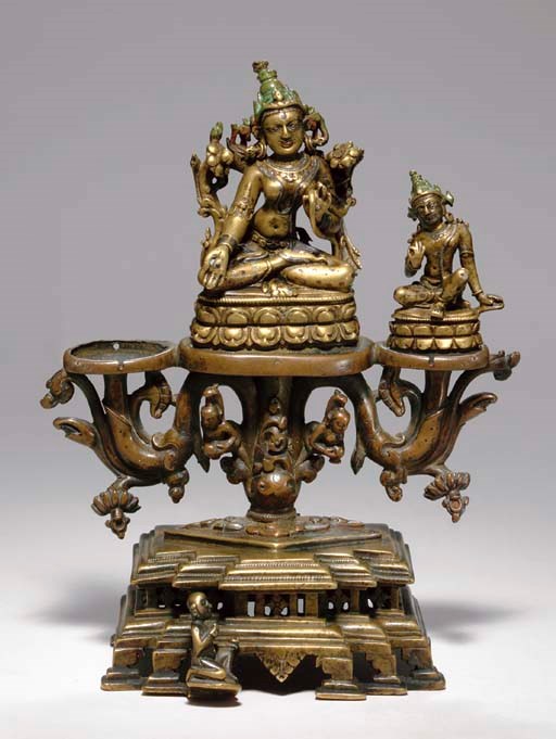 A BRONZE TRIAD OF TARA AND PADMAPANI