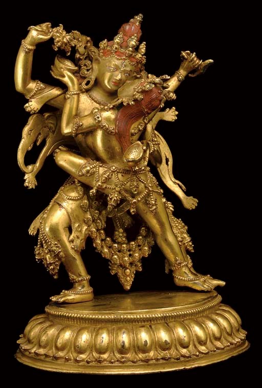 A GILT BRONZE FIGURE OF A WRATHFUL DEITY AND CONSORT