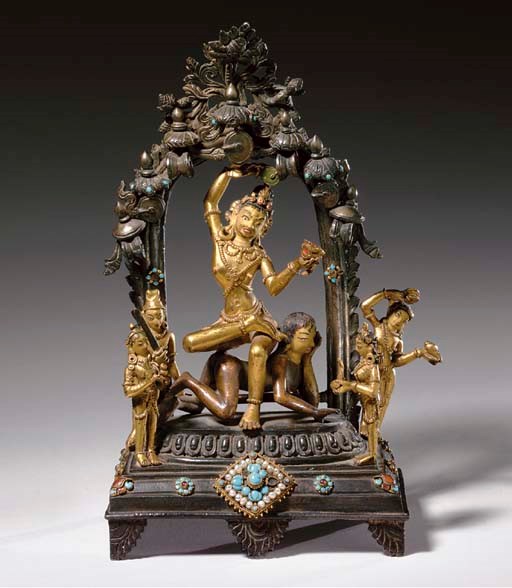 A GILT BRONZE FIGURAL GROUP OF MAHASIDDHA KRISHNACHARYA