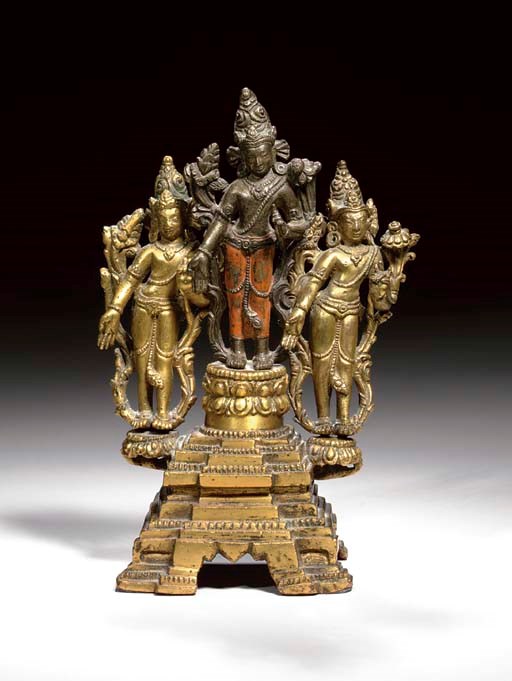 A GILT BRONZE TRIAD OF THE BODHISATTVAS MANJUSHRI, AVALOKITESHVARA AND VAJRAPANI