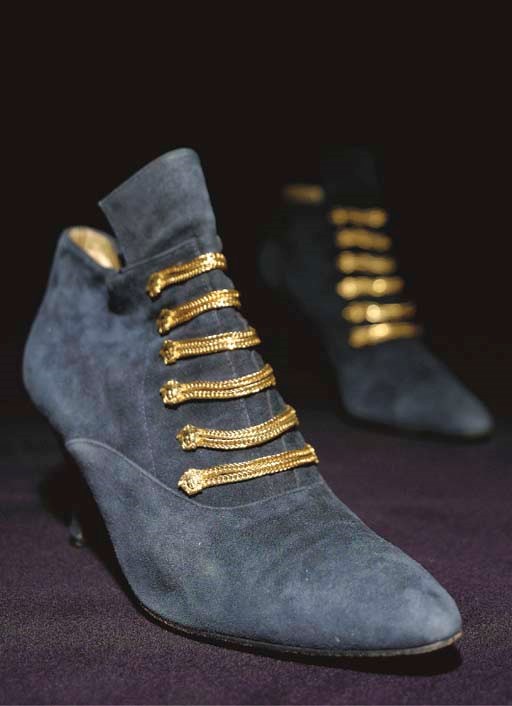 A PAIR OF VERSACE ANKLE BOOTS OF BLUE SUEDE trimmed with gilt chains with lion mask terminals, labelled inside GIANNI VERSACE, size 38