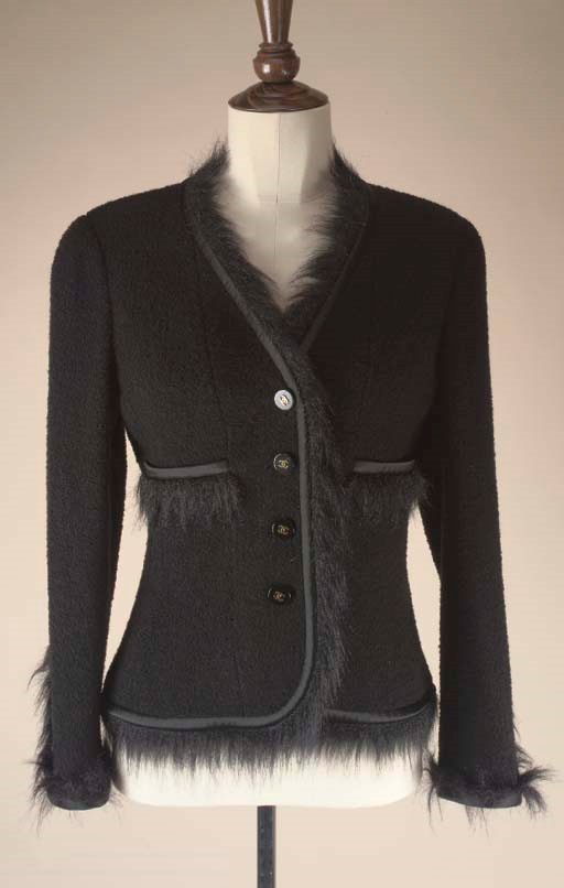 A BLACK MOHAIR FRINGED JACKET;