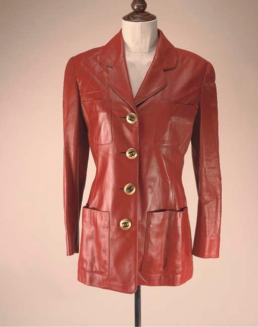 A SCARLET LEATHER JACKET WITH QUILTED DETAIL BY CHANEL;