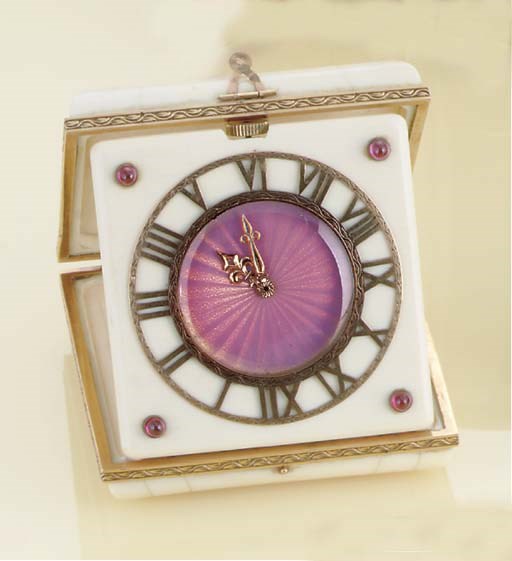 **A GOLD, IVORY AND RUBY TRAVEL TIMEPIECE