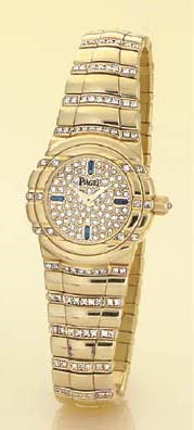 PIAGET. A LADY'S 18K GOLD, DIAMOND AND SAPPHIRE BRACELET WATCH