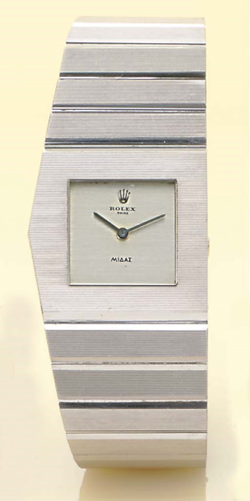 ROLEX. A RARE AND HEAVY 18K WHITE GOLD LEFT-HANDED PENTAGONAL BRACELET WATCH