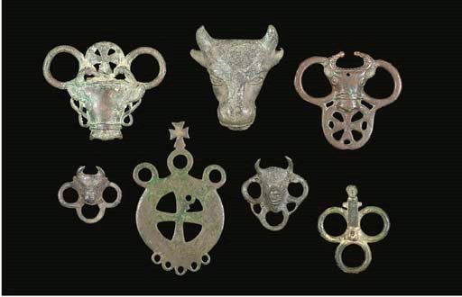 A GROUP OF EASTERN MEDITERRANEAN BRONZE RINGS WITH BULL HEADS