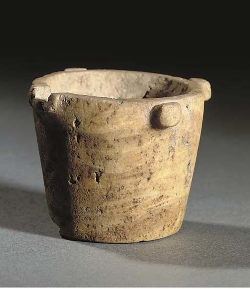 A MINOAN MINIATURE ALABASTER JAR