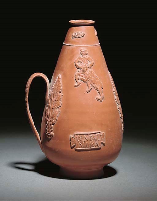 A ROMAN NORTH AFRICAN RED-SLIP WARE FLASK