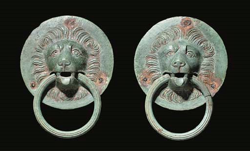 A PAIR OF ROMAN BRONZE LION-HEADED HANDLES