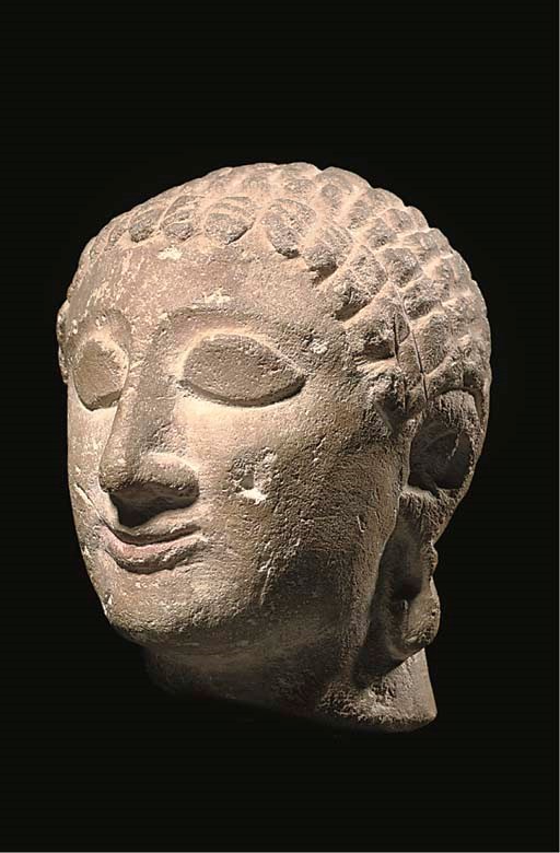 A CYPRIOT LIMESTONE HEAD