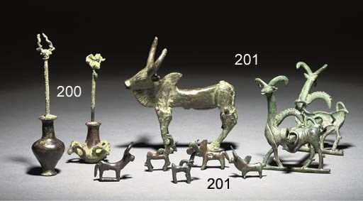 A GROUP OF WESTERN ASIATIC BRONZE VESSELS AND ANIMALS