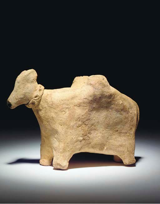 A NEAR EASTERN TERRACOTTA MODEL OF A LADEN DONKEY