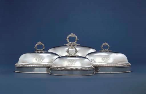 A GRADUATED SUITE OF FOUR OLD SHEFFIELD PLATE MEAT DISH COVERS AND HANDLES