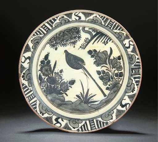 A SAFAVID MONOCHROME GLAZED DISH, IRAN, 17TH CENTURY