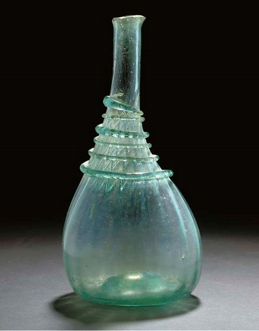 A PALE GREEN IRIDESCENT GLASS BOTTLE, IRAN, SHIRAZ, 18TH CENTURY