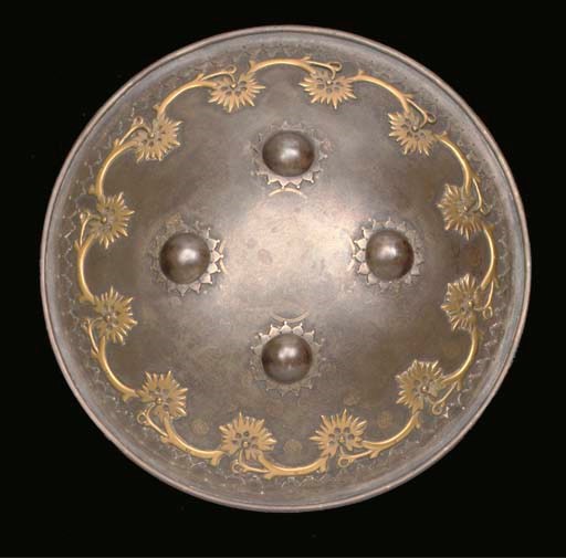A NORTH INDIAN DAMASCENED STEEL AND BRASS SHIELD, 19TH CENTURY